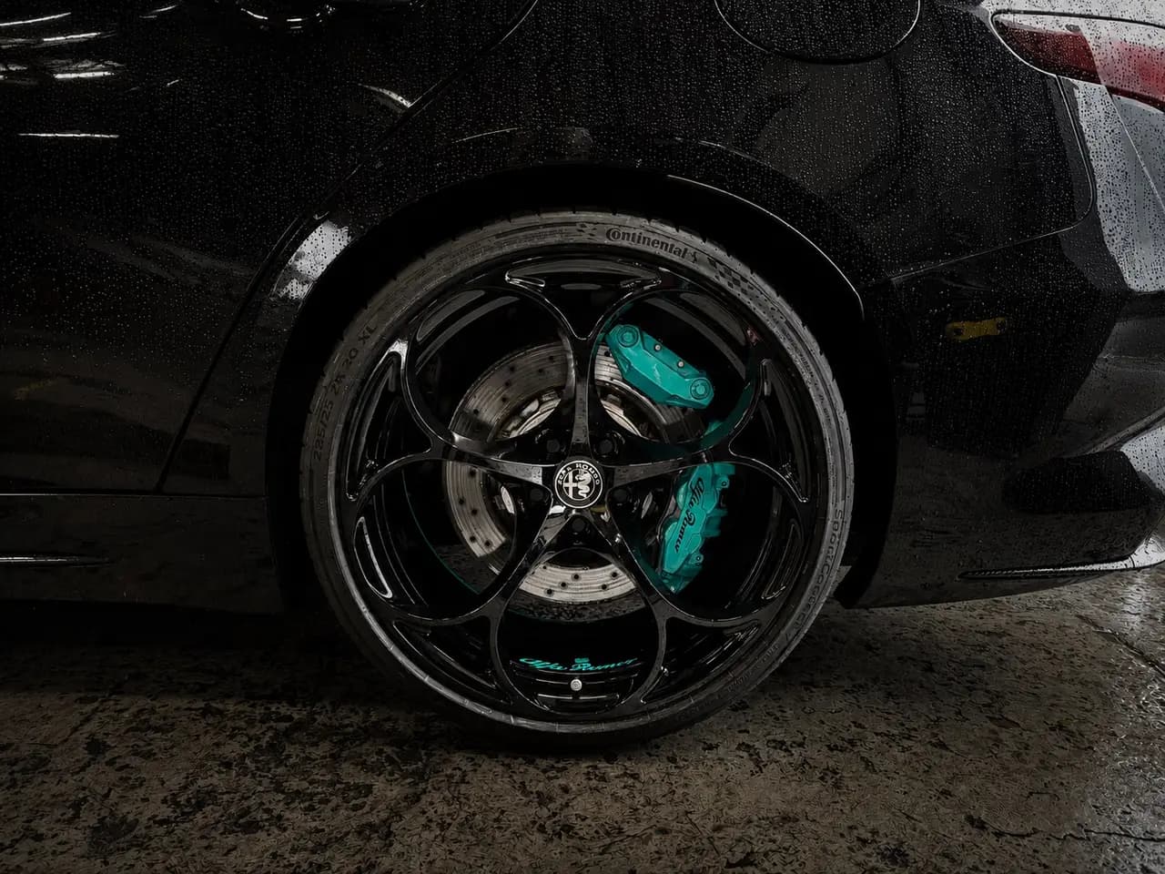 Alfa Romeo alloy wheels with black and teal brake calipers, AutoPerfect Stone